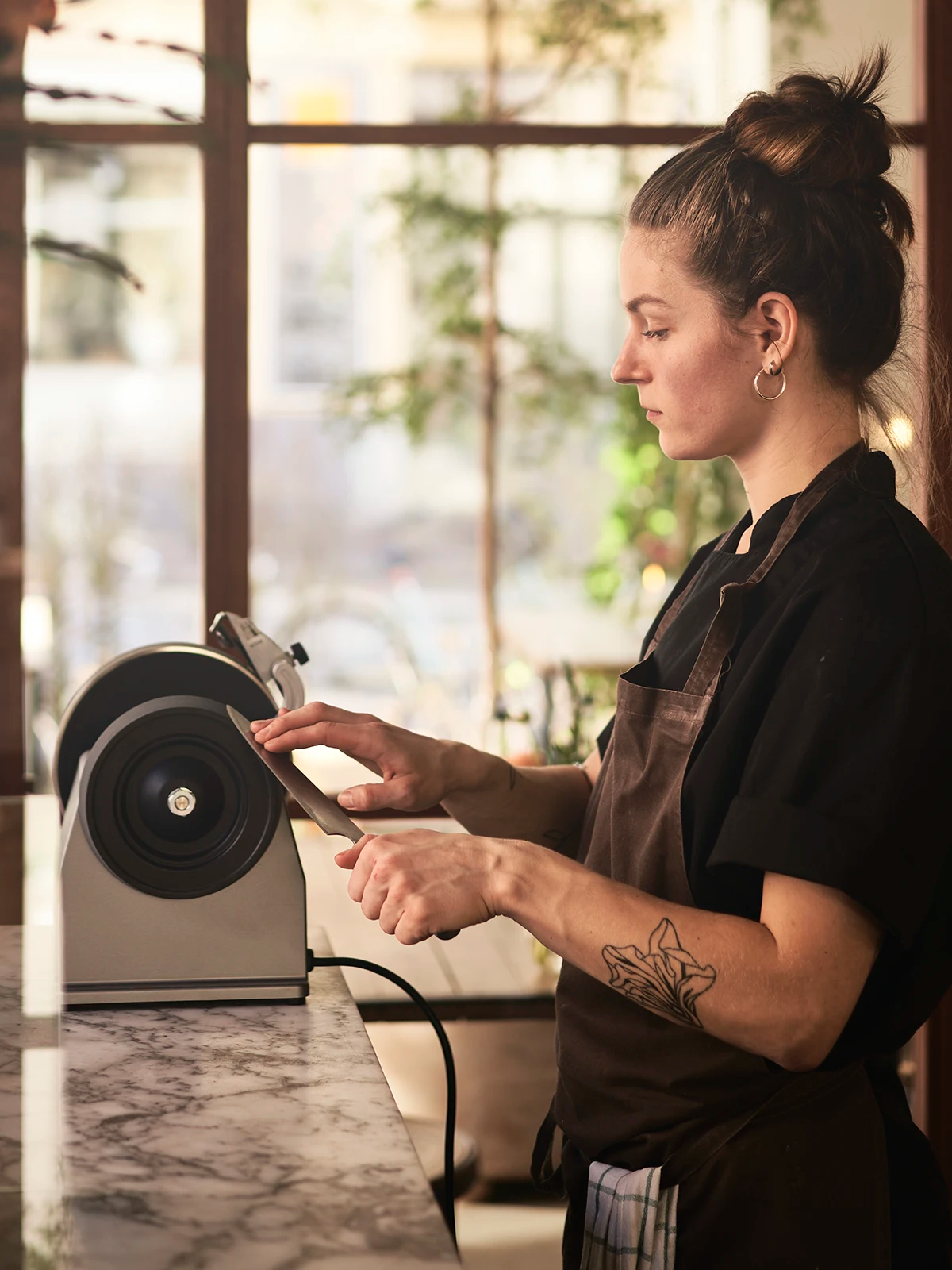 Honing a chef knife in a restaurant setting